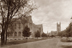 In this photograph dated sometime after 1924, sapling lindens border the lane that runs past St. Mary’s Hall (left) to Gasson Hall (right). The spire of Devlin Hall is visible in the background at center.<br/>Photograph: Courtesy of the Burns Library Archives