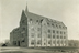In 1924, Devlin Hall (west facade, above) was the third building to open on the Heights, after St. Mary’s in 1917. However, it was the fourth building for which ground was broken. Preparations for Bapst Library began in 1922 but stalled as funding failed to materialize. <br/>Photograph: Courtesy of the Burns Library Archives