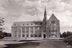When Devlin Hall was completed in 1924, it became the campus’s first building dedicated to the sciences. (It now houses the McMullen Museum of Art, the Office of Undergraduate Admission, and the departments of Fine Arts and Earth and Environmental Sciences.)  In 1952 the building was named for William Devlin, SJ, Boston College’s 15th president (1919–25). Visible at far right is the east entrance to Gasson Hall. <br/>Photograph: Courtesy of the Burns Library Archives.