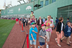 Following the Mass, attendees strolled along the warning track.<br/>Photograph by Gary Wayne Gilbert