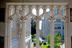 The refabricated arches of the west portico frame a view of Lyons Hall.<br/>Photograph: Caitlin Cunningham