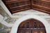 The west portico’s new ceiling of vertical-grain Douglas fir; the original carving above the doors was refinished.<br/>Photograph: Caitlin Cunningham